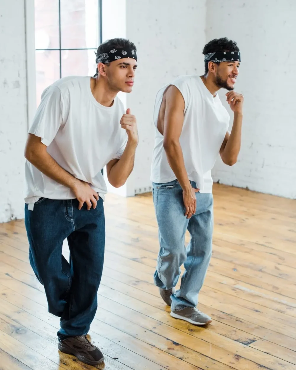 handsome-multicultural-dancers-in-headbands-dancing-hip-hop-e1684994207802